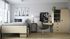 bedroom with bed, closet and storage space, study desk and chair