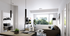 living room with sectional couch, coffee table, TV + TV stand