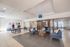 Bright and welcoming common area with stylish blue seating, table tennis, and modern decor, perfect for relaxation and social gatherings.