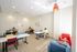 Bright and inviting study room with colorful seating, modern decor, and ample natural light.