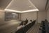 Luxury apartment building's private theater room with comfortable seating and a large screen, perfect for movie nights.