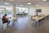 Bright and spacious study lounge with modern furnishings, large windows, and comfortable seating, ideal for productivity and relaxation.