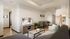 Inviting modern living room with cozy seating, stylish decor, and a sleek TV setup, connected to an open dining area and a contemporary kitchen.