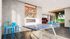 Modern recreation room with ping pong table, arcade games, and a chic bar area, perfect for entertainment.