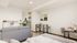 Modern studio apartment with a cozy living area, stylish kitchenette, and chic dining space, perfect for city living.