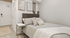 Inviting bedroom with modern decor, featuring a plush bed, cozy blankets, and minimalist artwork on the wall.