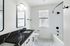 Shared bathroom with sleek finishes.