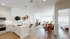 Bright and airy open-concept apartment with a modern kitchen, cozy living room, and inviting bedroom, featuring stylish decor and natural light.