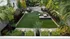 Charming garden retreat featuring lush greenery, cozy seating area, and vibrant landscaping.