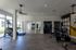 Modern gym with state-of-the-art fitness equipment and vibrant decor, perfect for a dynamic workout experience.