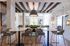 Sophisticated open-concept apartment with chic dining area, stylish high ceilings, and modern decor, perfect for contemporary living.