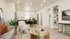 Open-concept great room at RailRunner townhomes with living, dining, and kitchen areas connected.