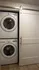 In-unit LG washer and dryer with modern sliding barn door in the Baker apartment at Millstone.