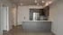 Open-concept kitchen and living area in the Granger floor plan at Millstone with oversized island and stainless steel appliances.