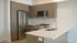 Contemporary kitchen in the Granger apartment at Millstone with stainless steel appliances, modern cabinetry, and generous counter space.