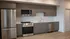 Open kitchen in the Oat floor plan at Millstone with modern cabinetry, stainless steel appliances, and spacious countertops.