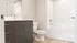 Modern bathroom in the Granger floor plan at Millstone featuring contemporary vanity, sleek fixtures, and full bathtub shower combination.