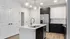 Kitchen with white and dark cabinetry - Angel Floor Plan