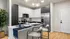 Open concept kitchen with island and stainless steel appliances