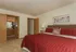 Primary Bedroom facing Ensuite Bathroom & Large Closet