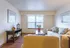 Living Room with a large window and plank flooring