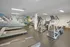 Spacious apartment gym with modern fitness equipment including treadmills and weights.