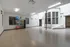 Spacious fitness studio with exercise balls and weights in upscale apartment