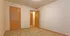 Inviting bedroom with soft carpet and wooden doors, ideal for comfort and style.