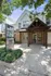 Entrance of Stationside Village rental office with lush green surroundings and inviting architecture.
