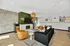 Modern and inviting living room with stylish decor, featuring a cozy fireplace, elegant lighting, and comfortable seating for a warm ambiance.
