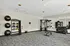 Modern fitness center with state-of-the-art equipment, vibrant exercise balls, and sleek free weights.