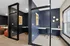 Modern co-working spaces with sleek blue walls, elegant lighting, and comfortable seating ideal for productivity.