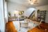 Bright and inviting living room with modern furniture, wooden floors, and tasteful decor, perfect for relaxation and entertaining.