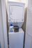 Compact laundry nook featuring a modern stackable washer and dryer, ideal for efficient apartment living.