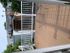 Charming apartment balcony with elegant railings and cozy seating, offering a relaxing outdoor space.