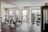 Sleek modern gym with exercise bikes and large windows for natural light, perfect for invigorating workouts.