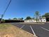Vast, well-maintained apartment complex with ample parking and lush greenery, perfect for modern living.
