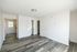 Bright and modern open-plan living area featuring sleek wood flooring and abundant natural light.