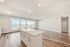 Bright and modern open-plan living area with sleek wood flooring and breathtaking panoramic views.