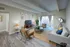 Chic living room with modern furnishings, bright natural light, and stylish decor, perfect for entertaining.