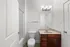 Contemporary bathroom with elegant lighting, modern fixtures, and a sleek vanity for a chic and functional space.