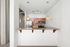 Modern kitchen with granite countertop, stainless steel appliances, and elegant pendant lighting, offering a sleek and inviting atmosphere.