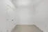 Bright room with crisp white walls, plush carpet flooring, and a sleek double closet door, ready for personalization and decor.