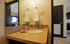 Elegant bathroom with granite countertop, modern fixtures, and soft lighting, offering a welcoming ambiance.
