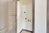 Bright and spacious laundry area featuring modern hookups and tiled flooring, perfect for efficient utility space.