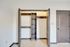 Spacious walk-in closet with modern shelving, enhancing storage solutions in this stylish apartment.