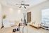 Inviting home office with modern desk setup, cozy seating area, and plenty of natural light.