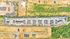Stunning aerial view of a modern apartment complex with ample parking surrounded by lush greenery and open spaces.