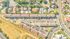 Vibrant aerial view of a charming residential neighborhood featuring rows of modern houses with ample parking and lush greenery.