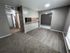 Modern apartment interior with sleek flooring, inviting open-concept layout, and cozy carpeting.